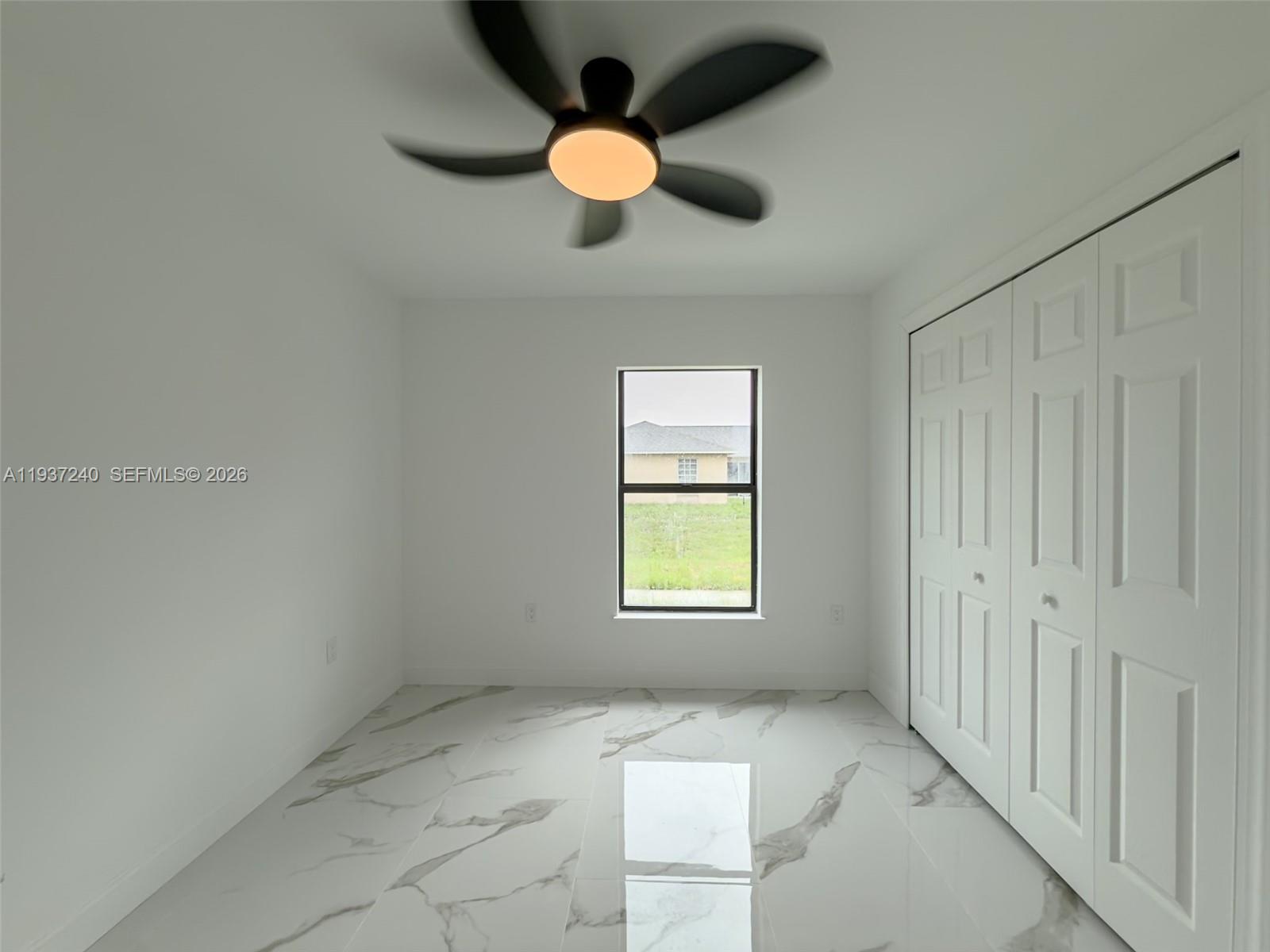842-844 Alabama Road South Lehigh Acres, FL 33974 - Photo 24 of 40 a view of an empty room with a window
