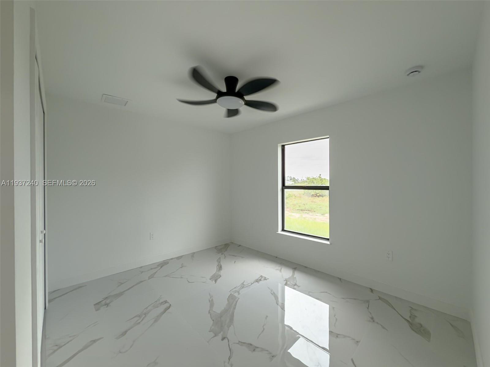 842-844 Alabama Road South Lehigh Acres, FL 33974 - Photo 27 of 40 a view of a window in an empty room
