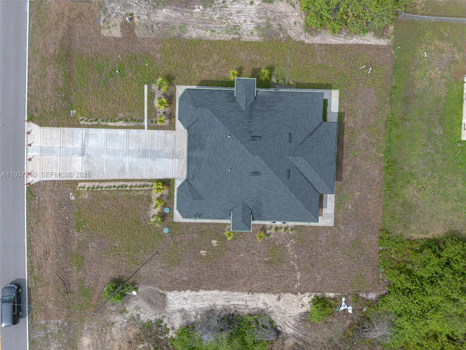 842-844 Alabama Road South Lehigh Acres, FL 33974 - Photo 6 of 40 an aerial view of a house with ocean view