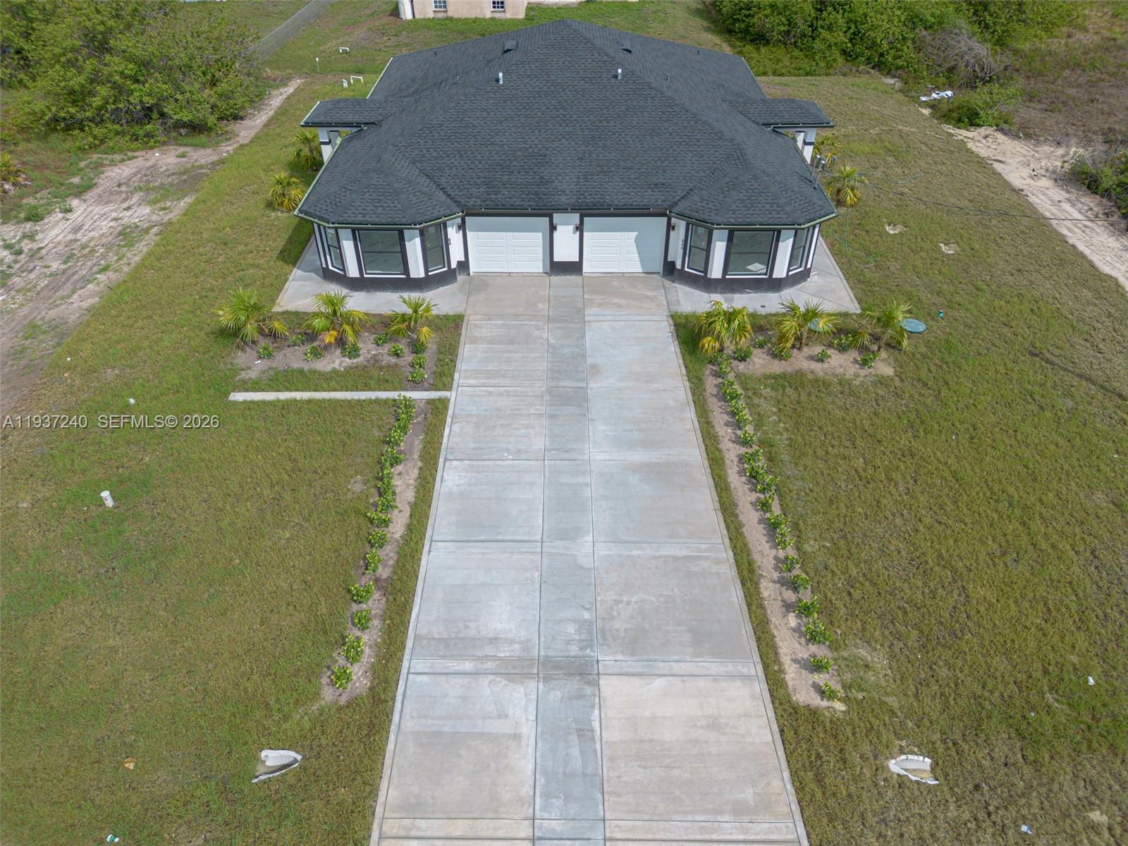 842-844 Alabama Road South Lehigh Acres, FL 33974 - Photo 7 of 40 an aerial view of a house