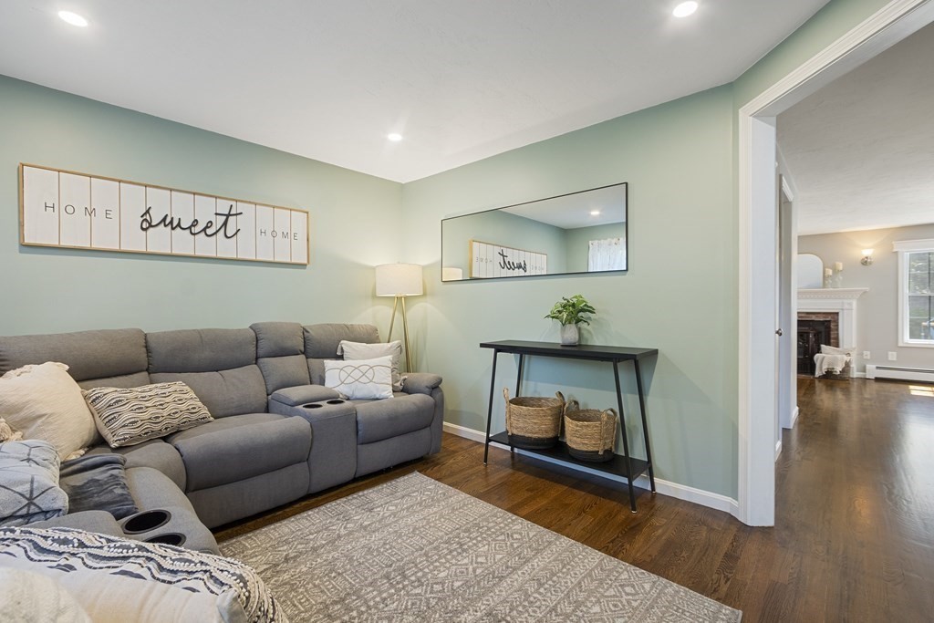 23 Taft Avenue Maynard, MA 01754 - Photo 15 of 42 a living room with furniture and a fireplace