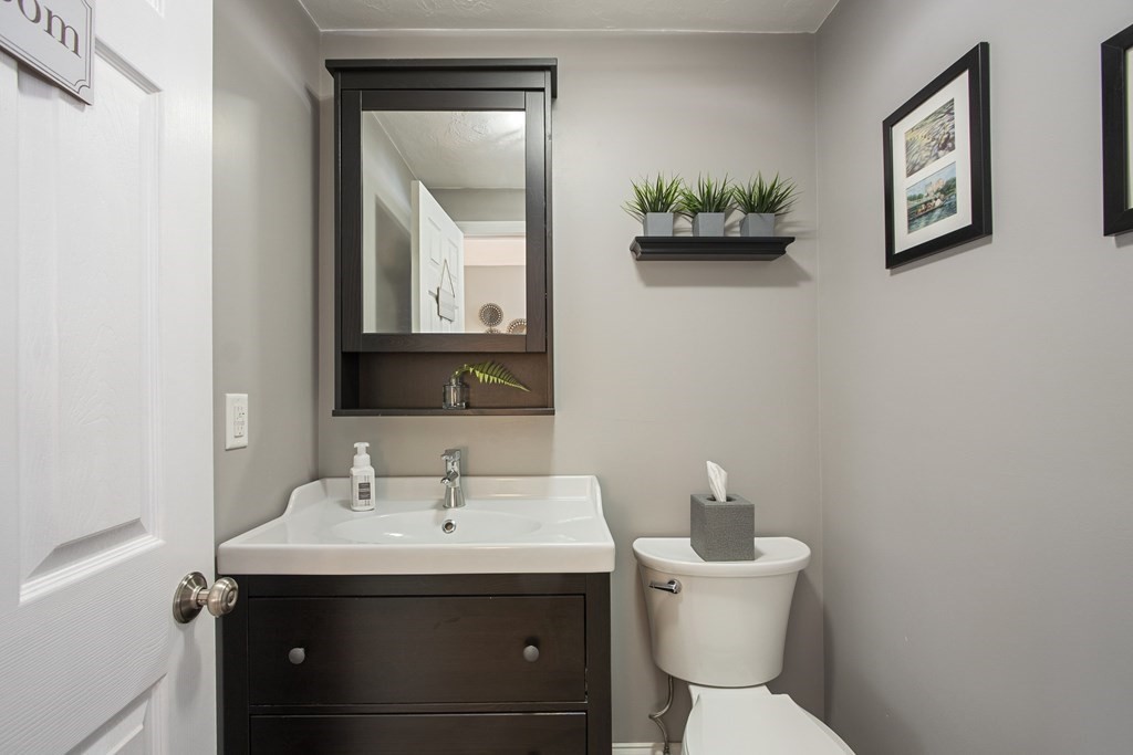 23 Taft Avenue Maynard, MA 01754 - Photo 16 of 42 a bathroom with a toilet sink and mirror
