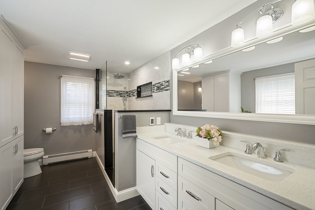 23 Taft Avenue Maynard, MA 01754 - Photo 22 of 42 a bathroom with a double vanity sink mirror and toilet