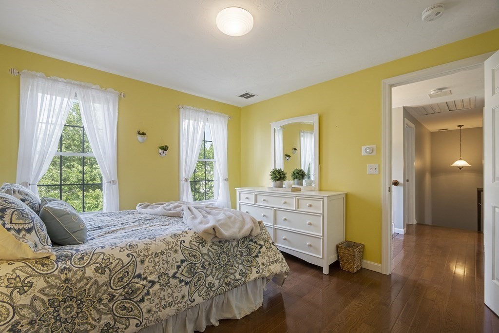 23 Taft Avenue Maynard, MA 01754 - Photo 29 of 42 a spacious bedroom with a bed and a dresser