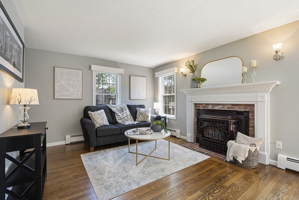 23 Taft Avenue Maynard, MA 01754 - Photo 3 of 42 a living room with furniture and a fireplace