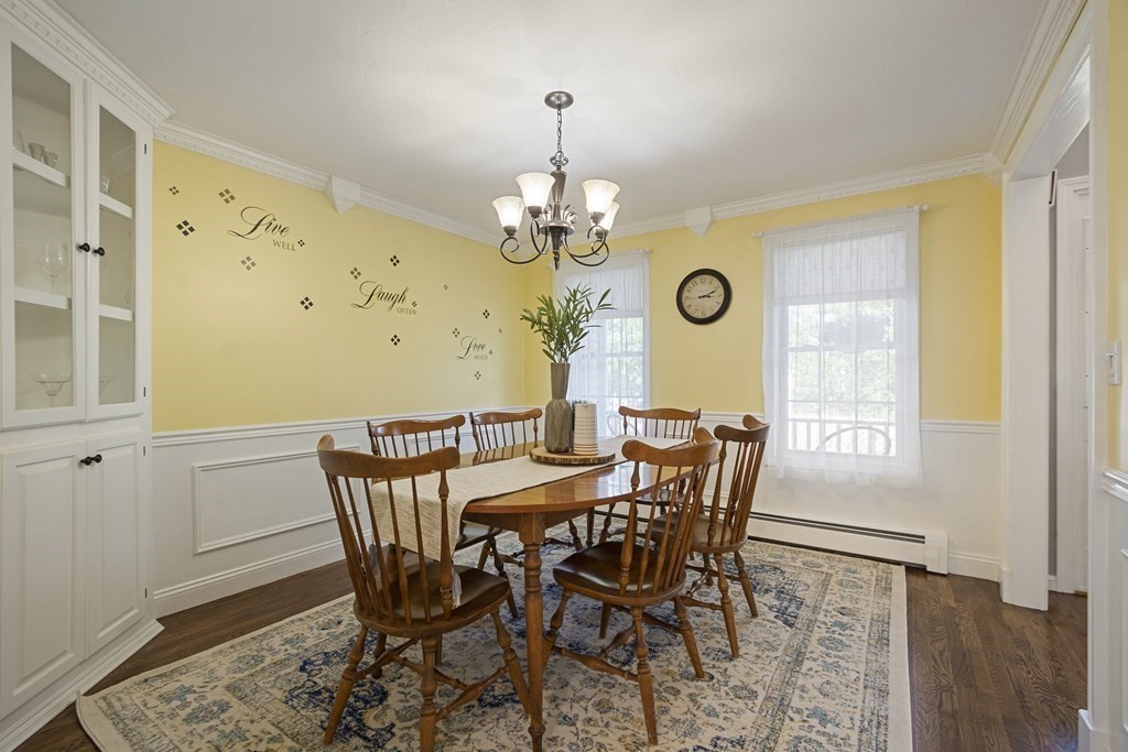 23 Taft Avenue Maynard, MA 01754 - Photo 6 of 42 a view of a dining room with furniture wooden floor and a chandelier