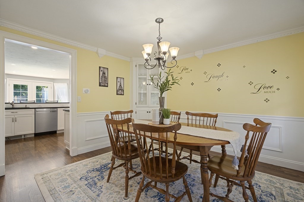 23 Taft Avenue Maynard, MA 01754 - Photo 7 of 42 a view of a dining room with furniture and wooden floor