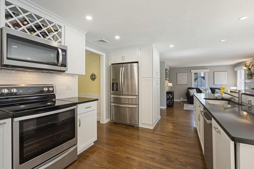 23 Taft Avenue Maynard, MA 01754 - Photo 10 of 42 a kitchen with stainless steel appliances a stove microwave and refrigerator