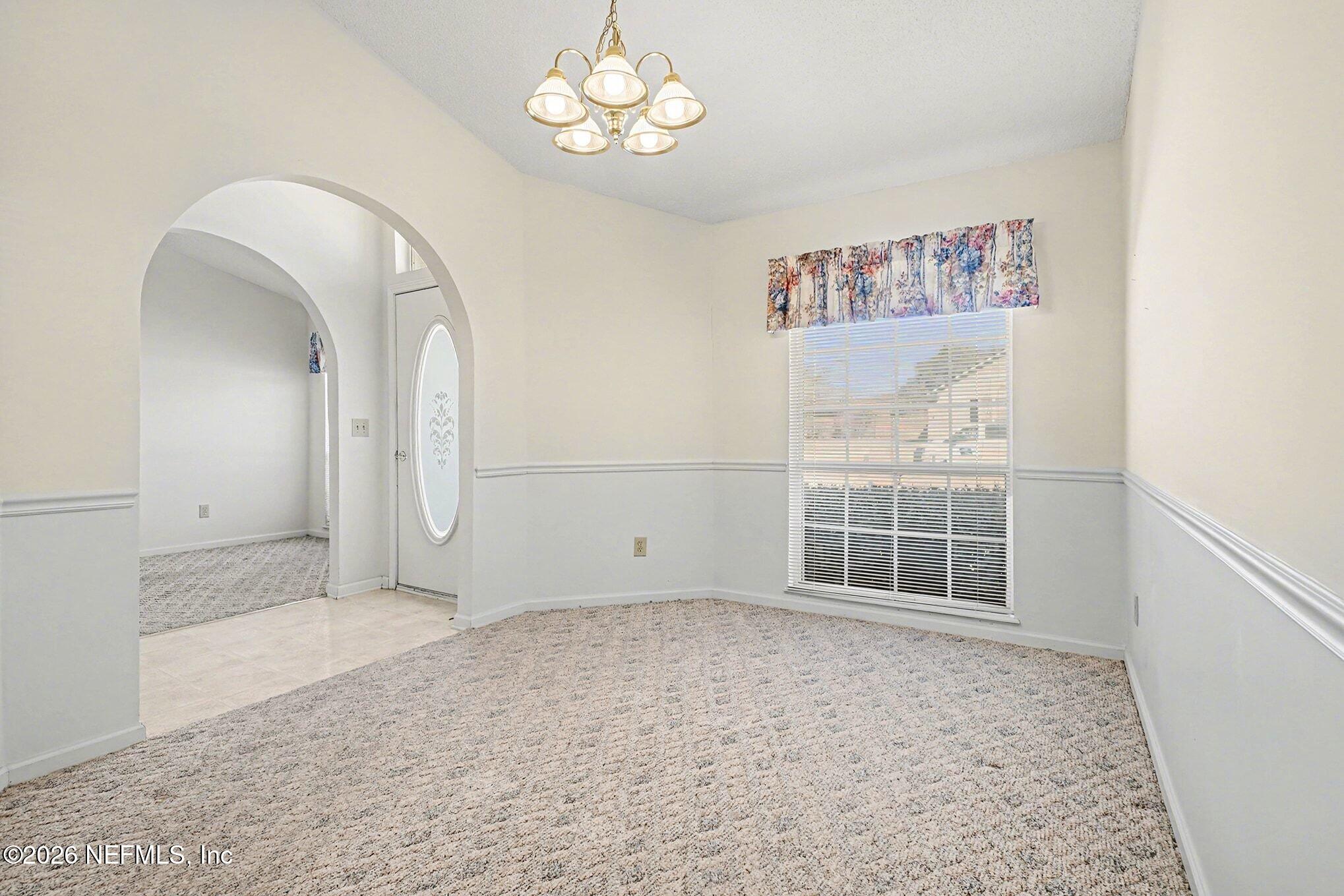 11958 Swooping Willow Road Jacksonville, FL 32223 - Photo 11 of 31 a view of empty room with a window