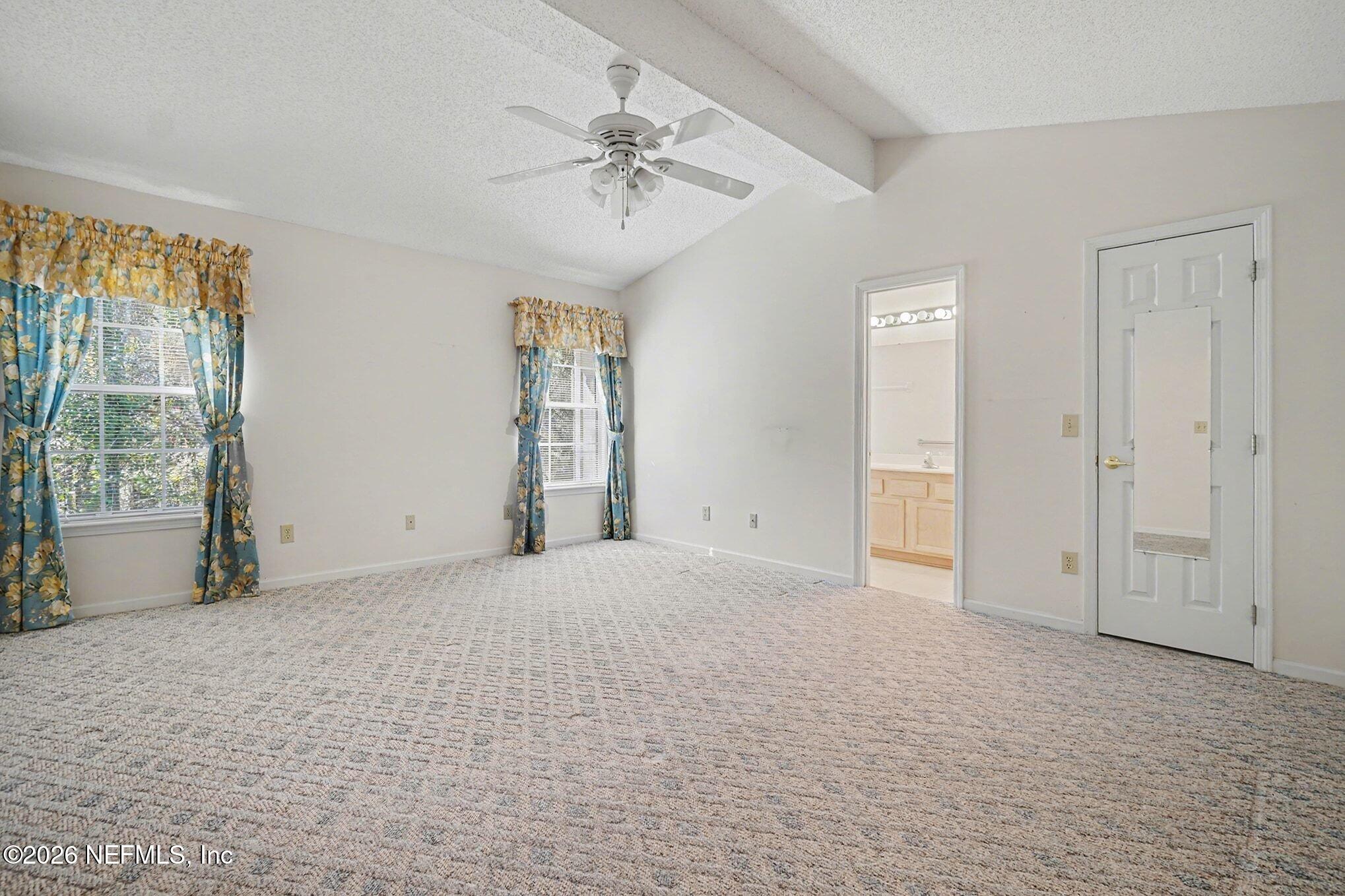 11958 Swooping Willow Road Jacksonville, FL 32223 - Photo 15 of 31 a view of an empty room with a window