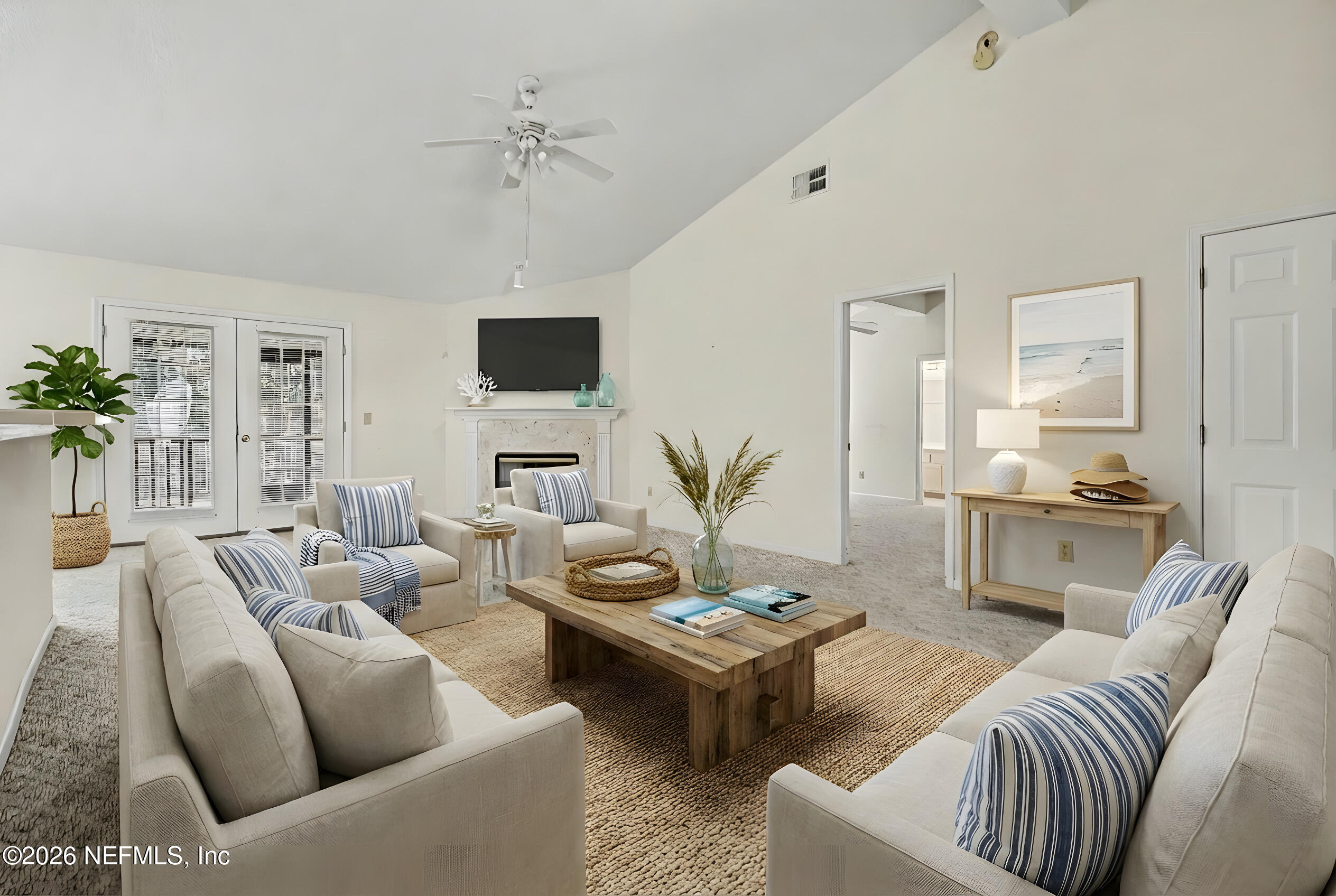 11958 Swooping Willow Road Jacksonville, FL 32223 - Photo 5 of 31 a living room with furniture and a flat screen tv