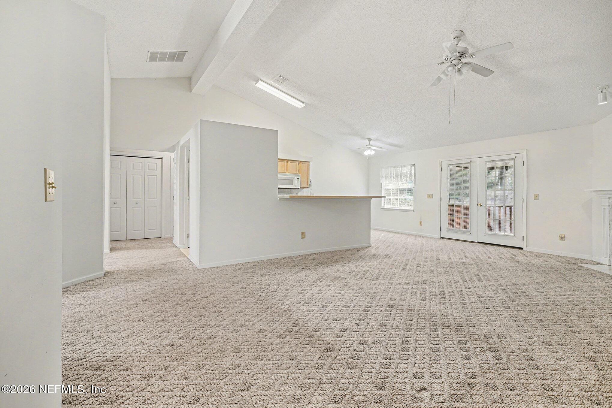 11958 Swooping Willow Road Jacksonville, FL 32223 - Photo 6 of 31 a view of an empty room with a window