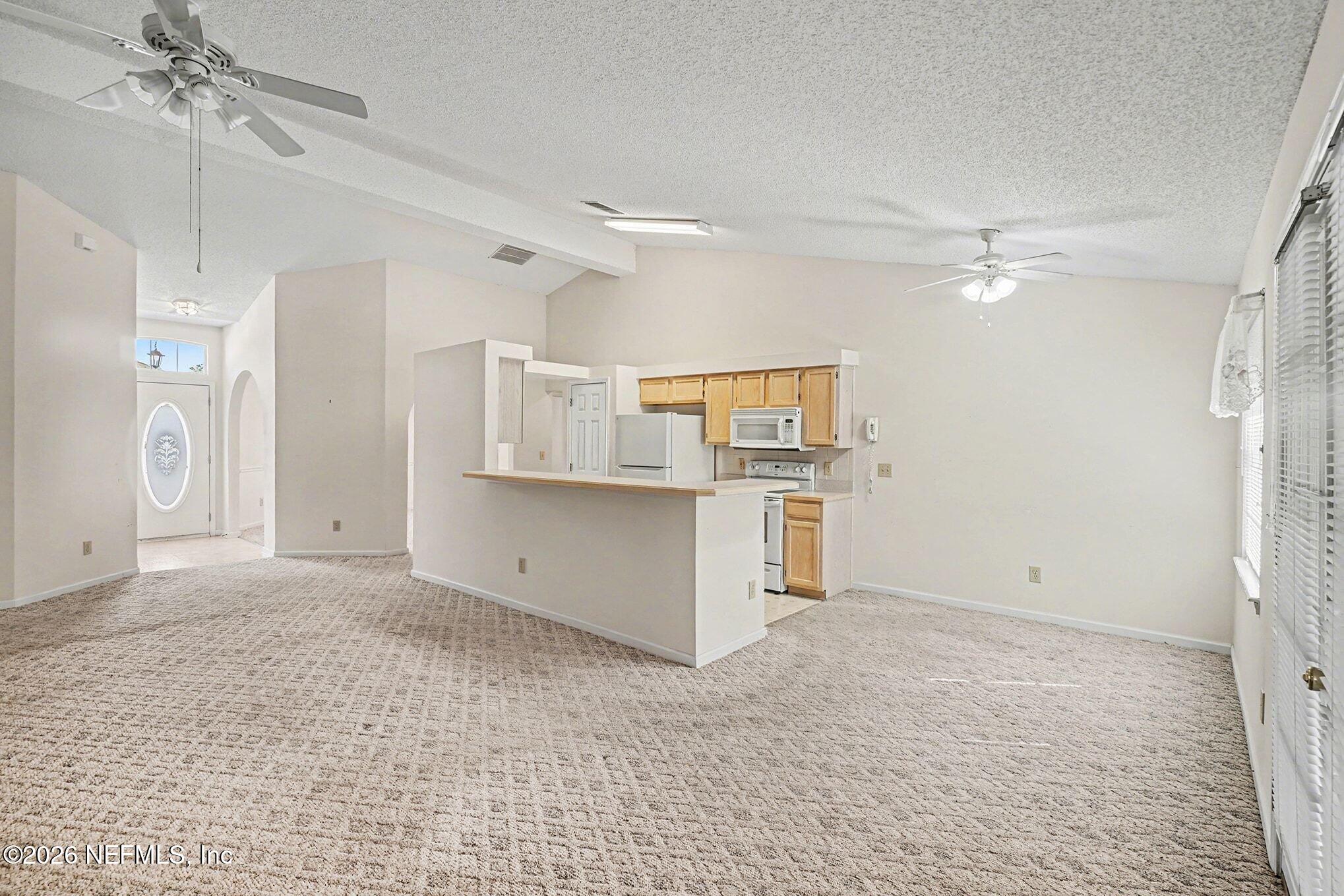 11958 Swooping Willow Road Jacksonville, FL 32223 - Photo 8 of 31 a view of a kitchen with a sink and cabinet area