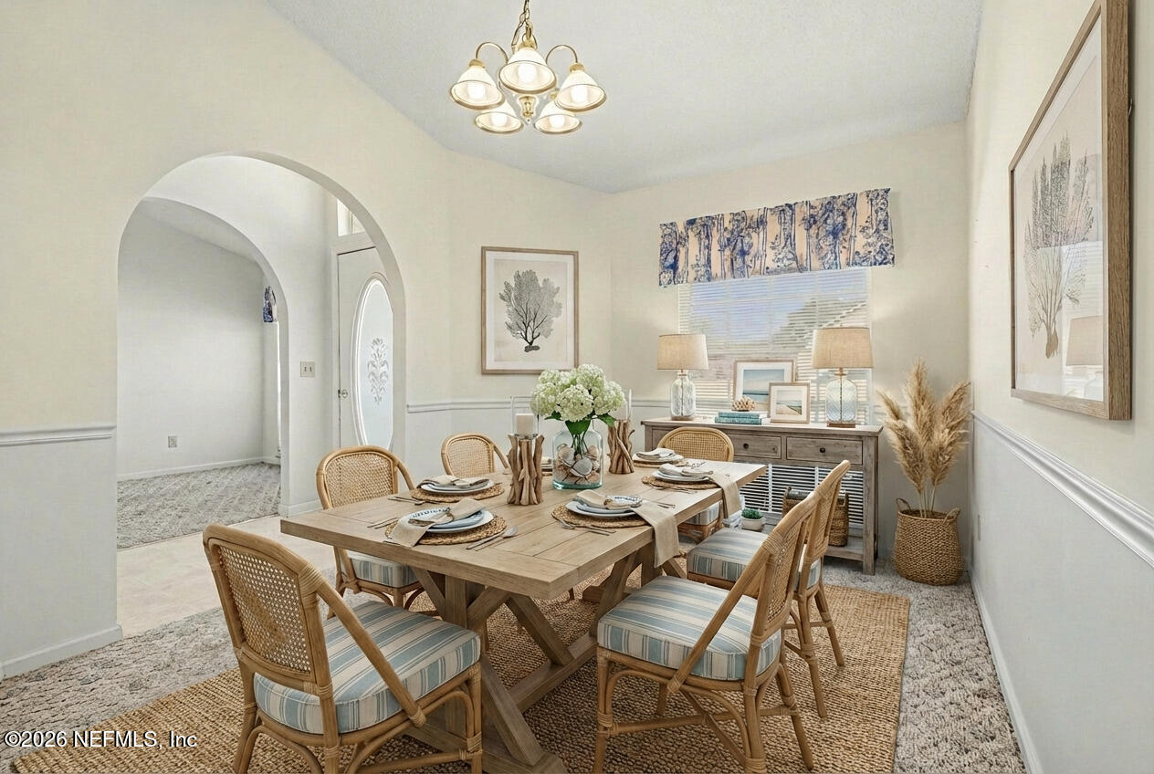11958 Swooping Willow Road Jacksonville, FL 32223 - Photo 10 of 31 a view of a dining room with furniture