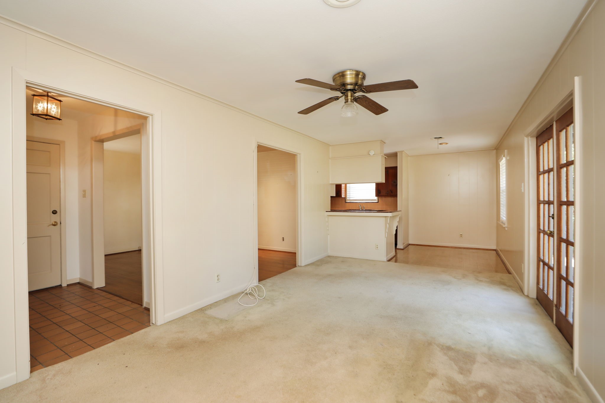 7158 Sharpview Drive Houston, TX 77074 - Photo 12 of 35 a view of a livingroom with a ceiling fan and window