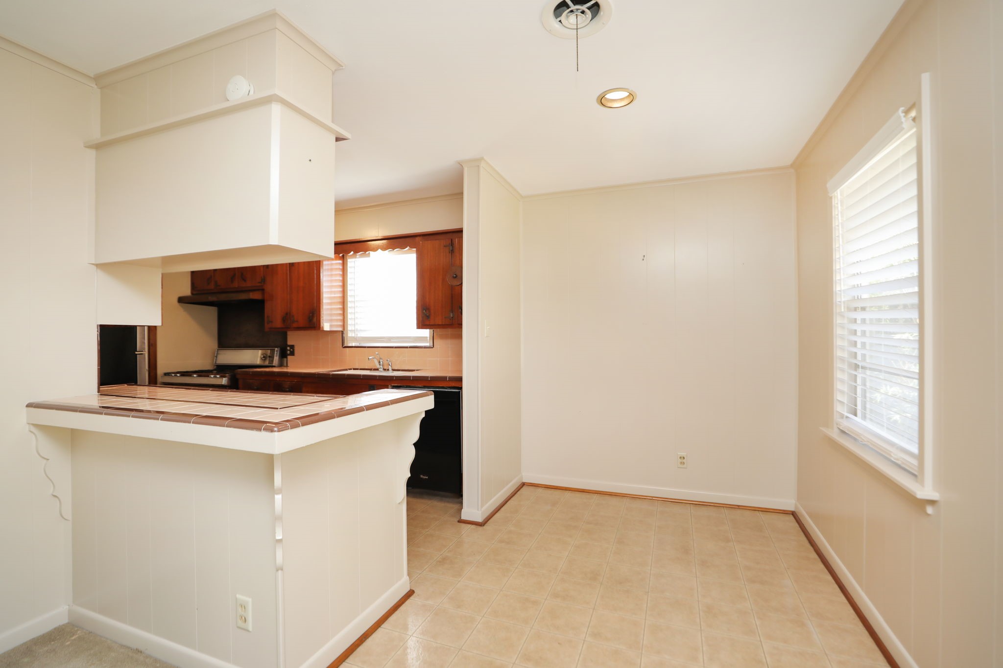 7158 Sharpview Drive Houston, TX 77074 - Photo 13 of 35 a kitchen with a stove and a microwave