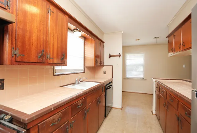 a kitchen with a sink and a window