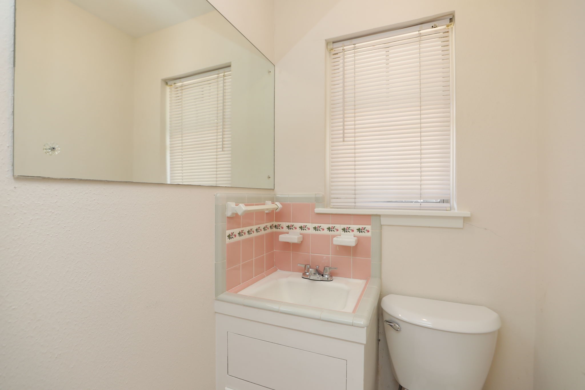 7158 Sharpview Drive Houston, TX 77074 - Photo 26 of 35 a bathroom with a toilet sink and mirror