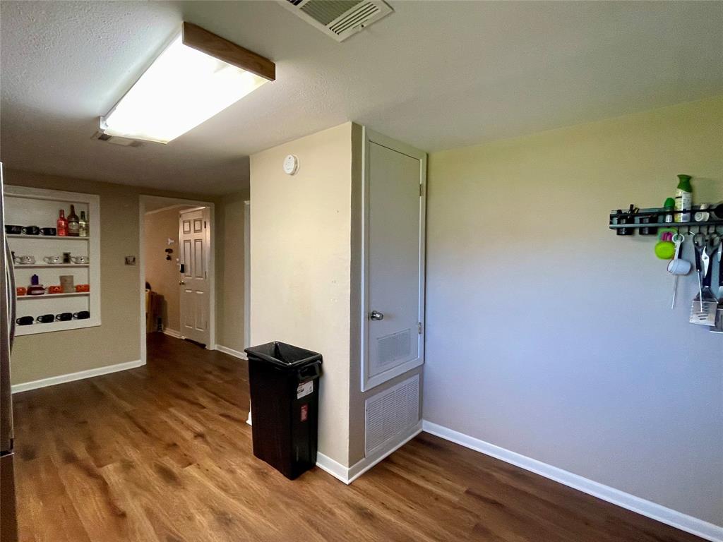 10806 Newson Road Keithville, LA 71047 - Photo 7 of 24 a view of hallway with wooden floor