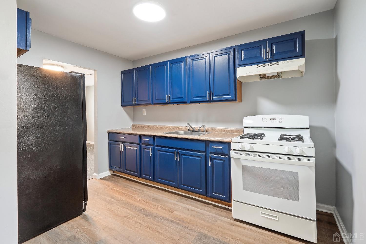 211 Kinsley Road Pemberton, NJ 08068 - Photo 8 of 15 a kitchen with granite countertop a stove top oven sink and cabinets