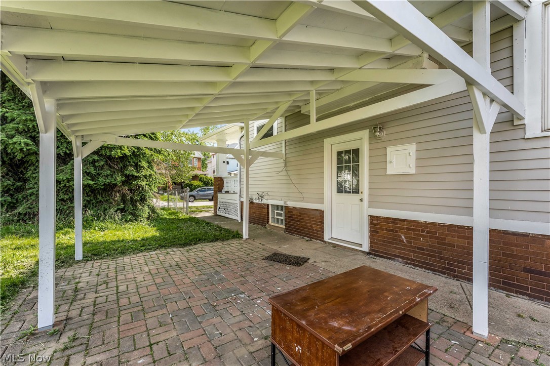 3506 Riverside Avenue Cleveland, OH 44109 - Photo 29 of 31 Covered patio featuring a brick paver surface and white support columns