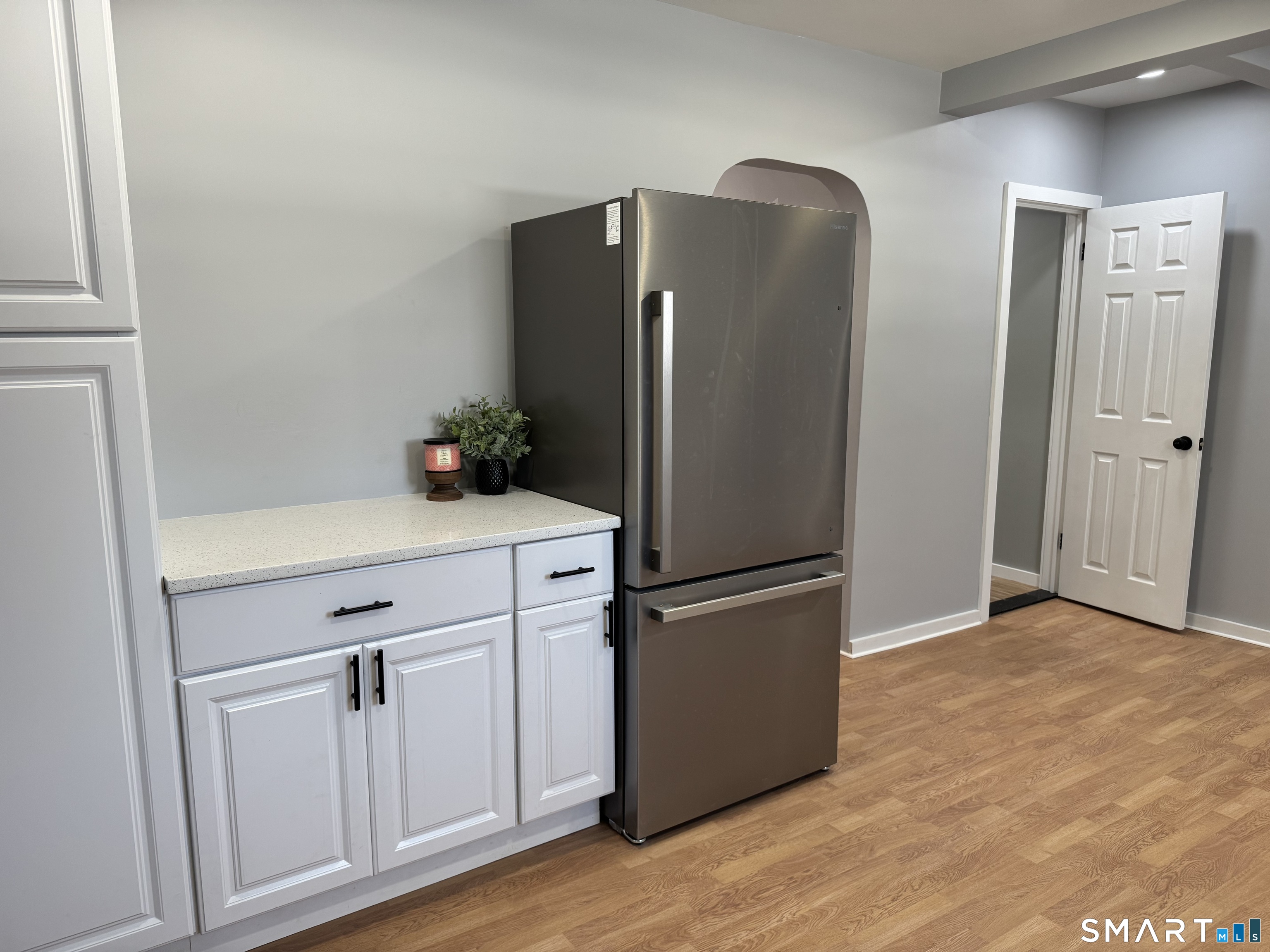 299 Linnmoore Street Hartford, CT 06106 - Photo 2 of 23 a kitchen with cabinets and stainless steel appliances