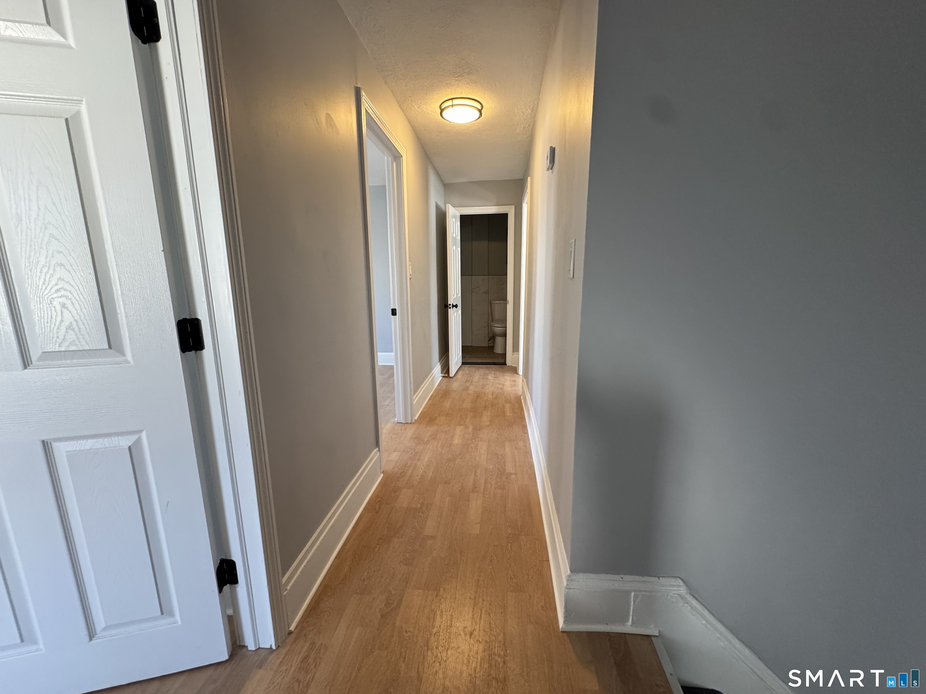 299 Linnmoore Street Hartford, CT 06106 - Photo 21 of 23 a view of a hallway with wooden floor