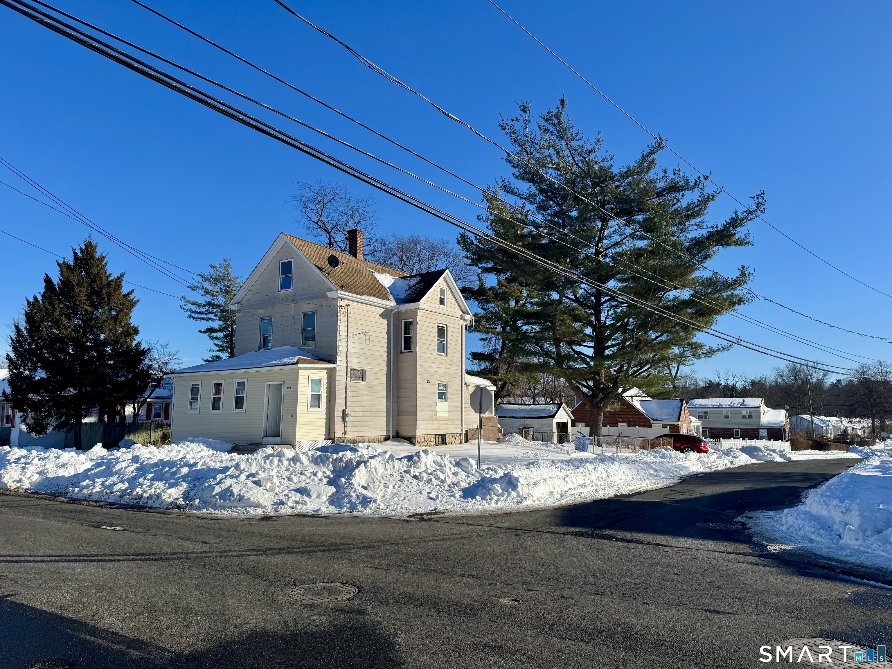 299 Linnmoore Street Hartford, CT 06106 - Photo 5 of 23 a view of street with flower on side of road