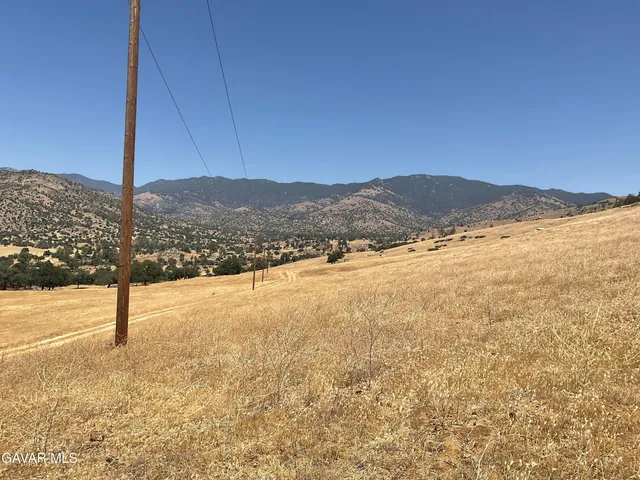 a view of an ocean and a mountain