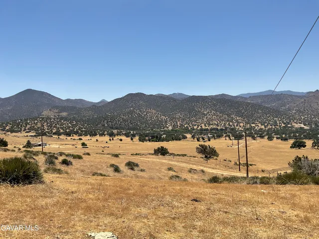 a view of mountain view with mountains in the background