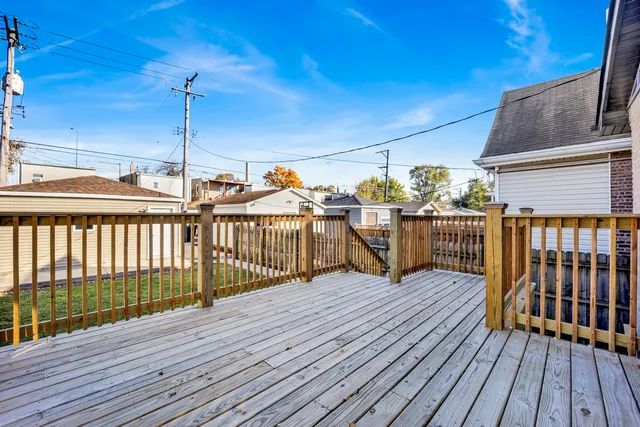 a view of a balcony with wooden floor