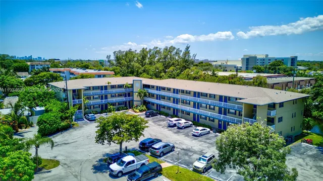 a view of a city that has tall trees