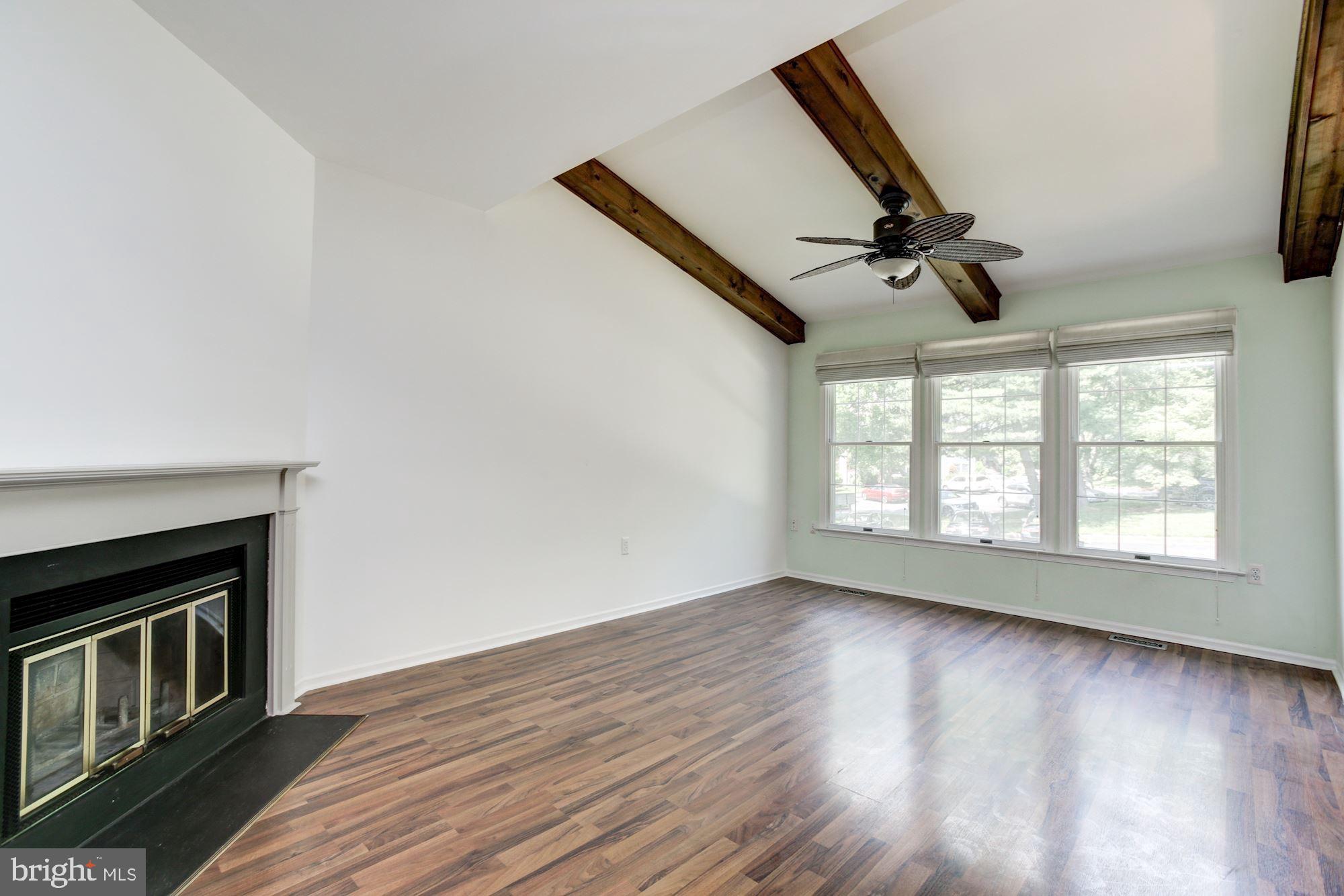 7531 Swan Point Way, Unit 192 Columbia, MD 21045 - Photo 5 of 35 Family room w/ wood burning fireplace