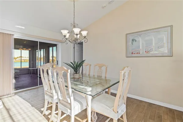 a dining room with furniture and chandelier