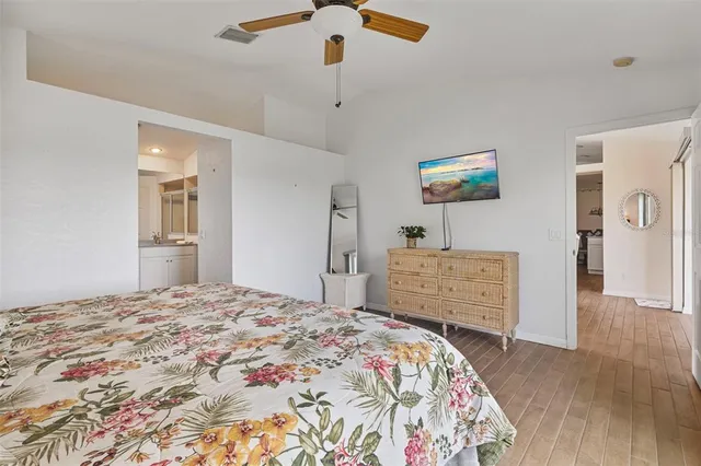 a bedroom with a bed and a dresser