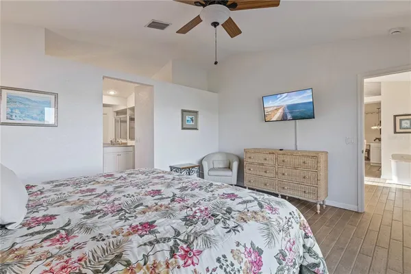 a bedroom with a bed and a dresser