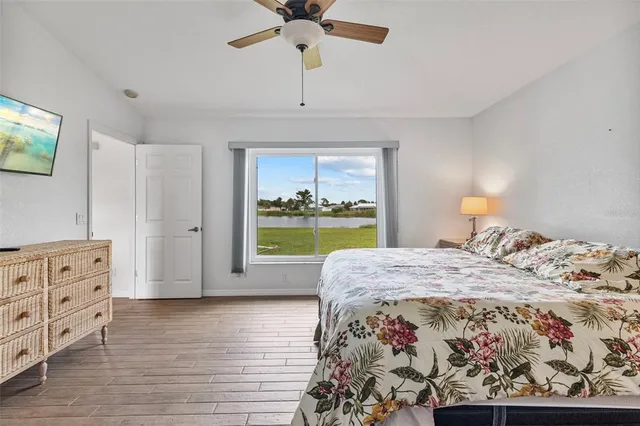 a bed room with a bed and a window