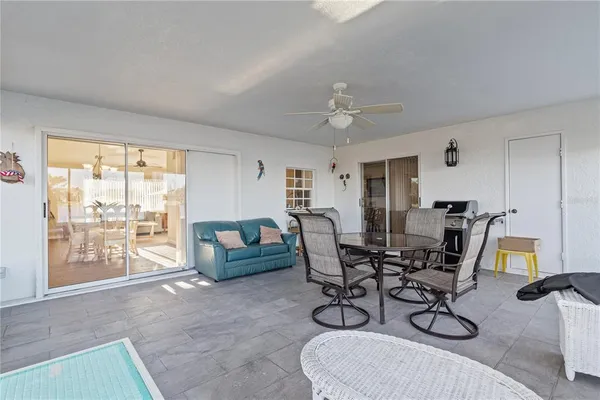 a view of a livingroom with furniture and a window