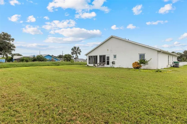 a view of a lake with houses in the background