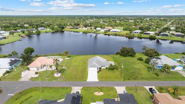 an aerial view of a city with lake view