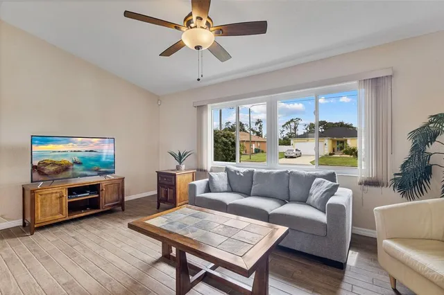 a living room with furniture and a window