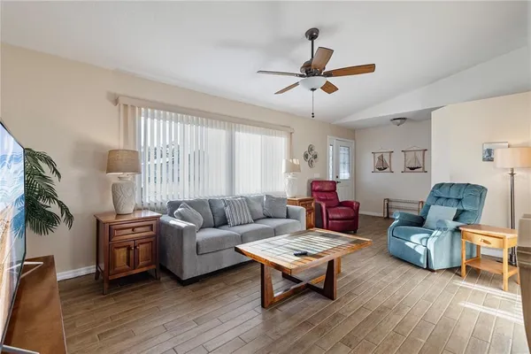 a living room with furniture and a window