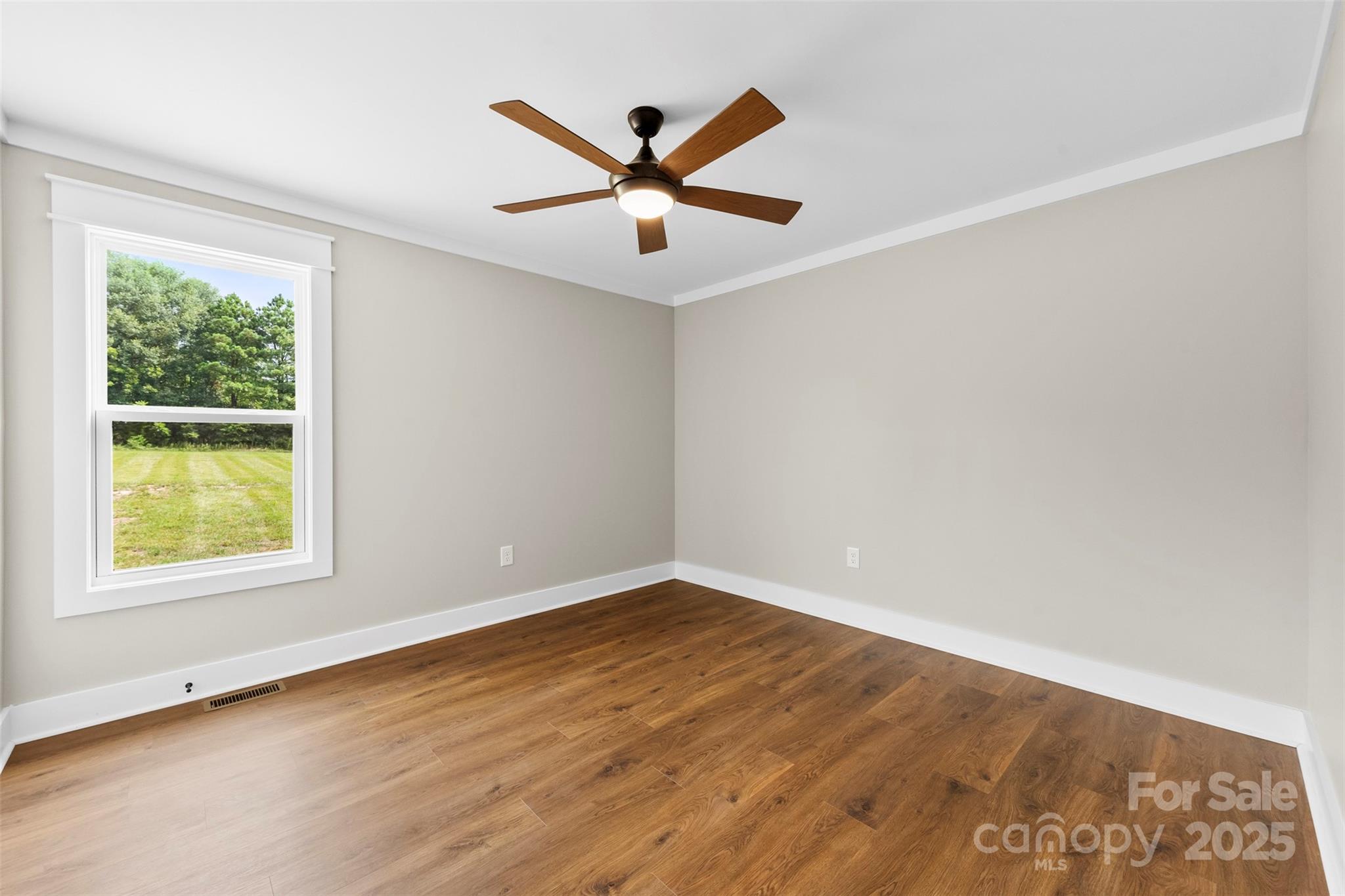 6788 Clyde Wehunt Road Cherryville, NC 28021 - Photo 13 of 25 wooden floor in an empty room with a window