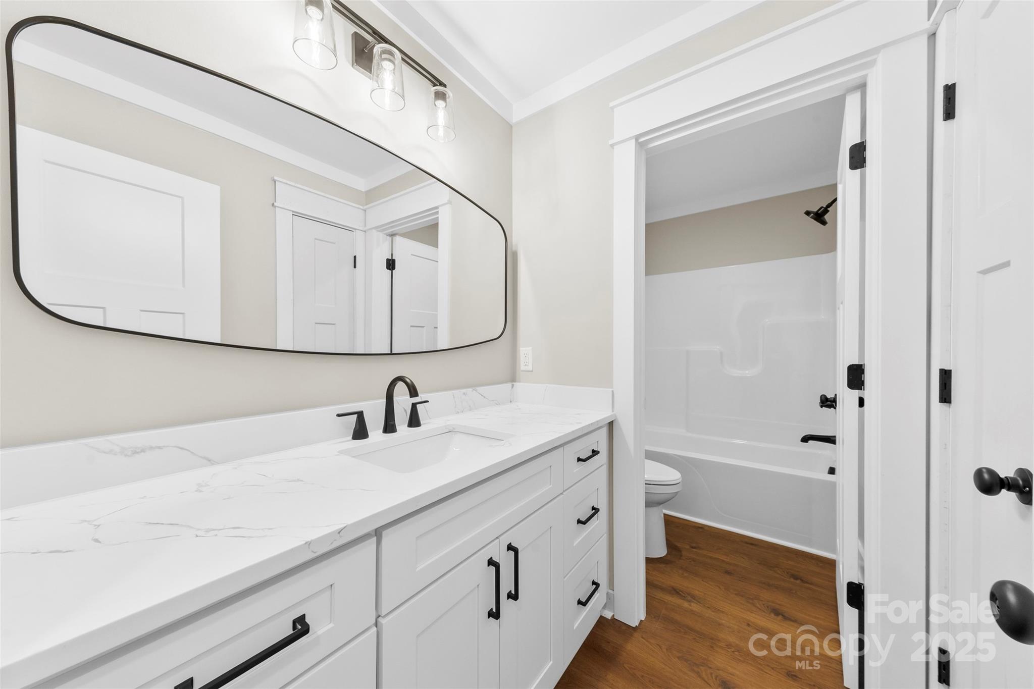6788 Clyde Wehunt Road Cherryville, NC 28021 - Photo 18 of 25 a bathroom with a sink and a mirror