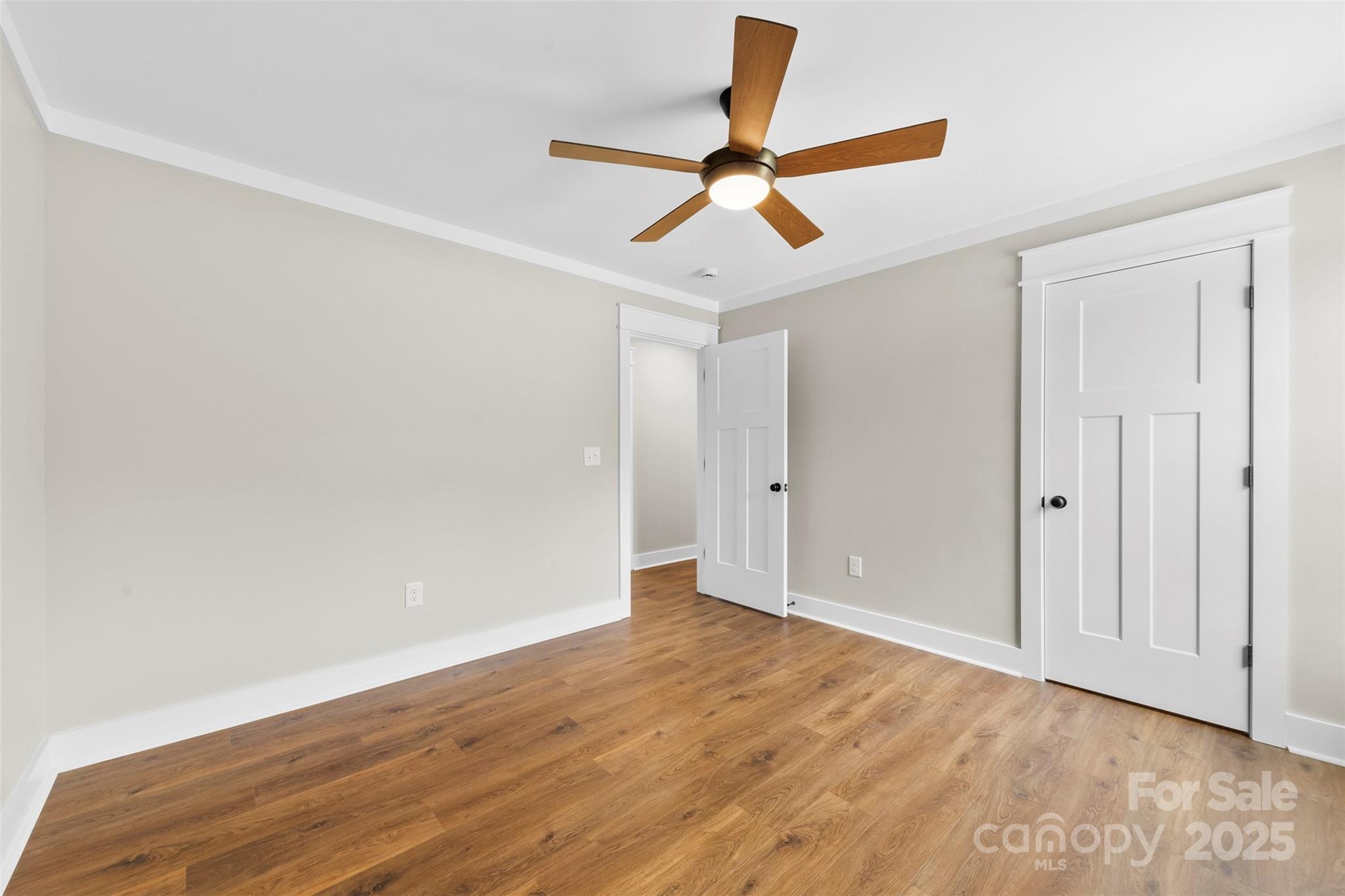 6788 Clyde Wehunt Road Cherryville, NC 28021 - Photo 19 of 25 an empty room with wooden floor and windows