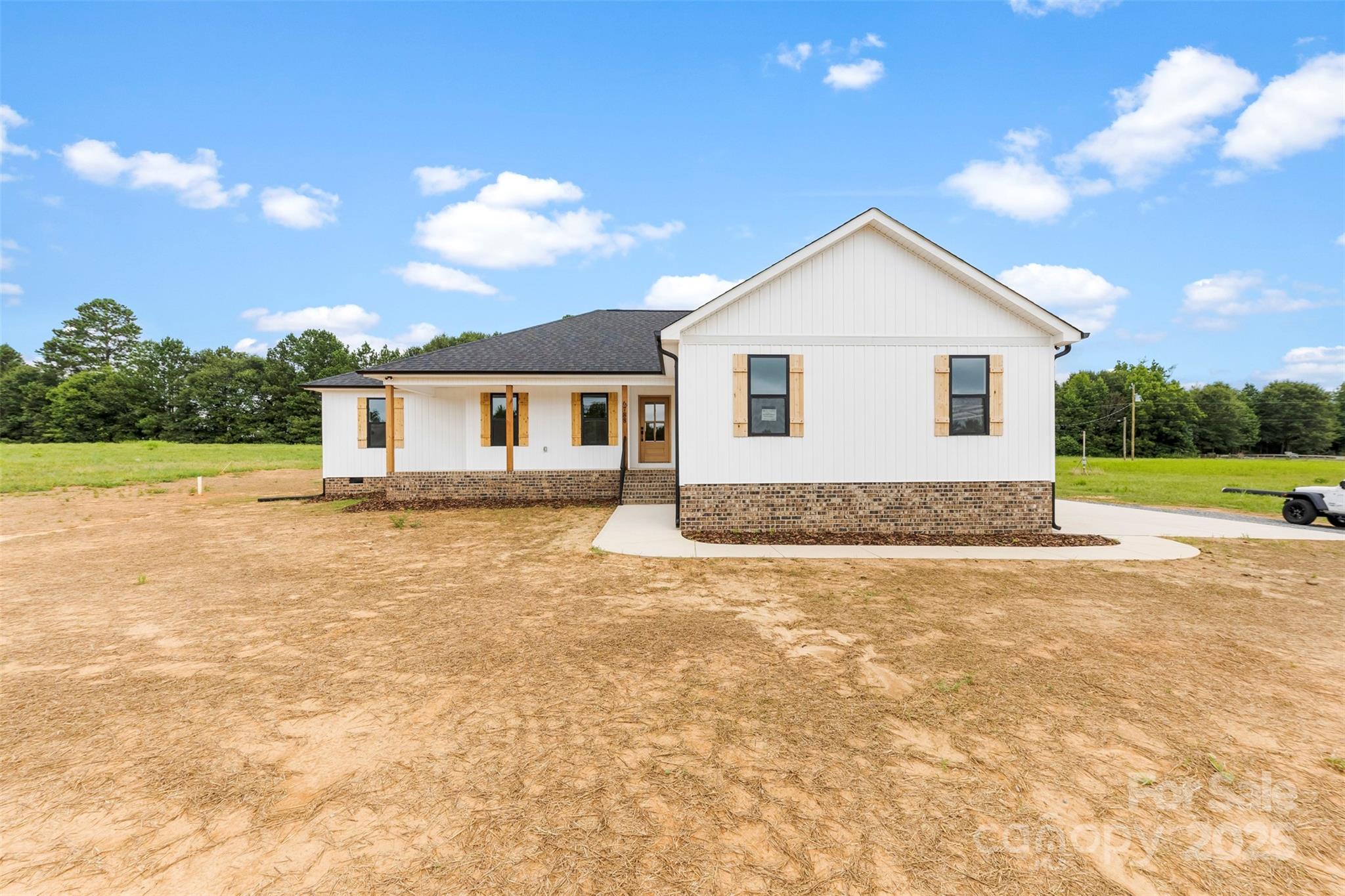 6788 Clyde Wehunt Road Cherryville, NC 28021 - Photo 21 of 25 a view of a house with yard and sitting area