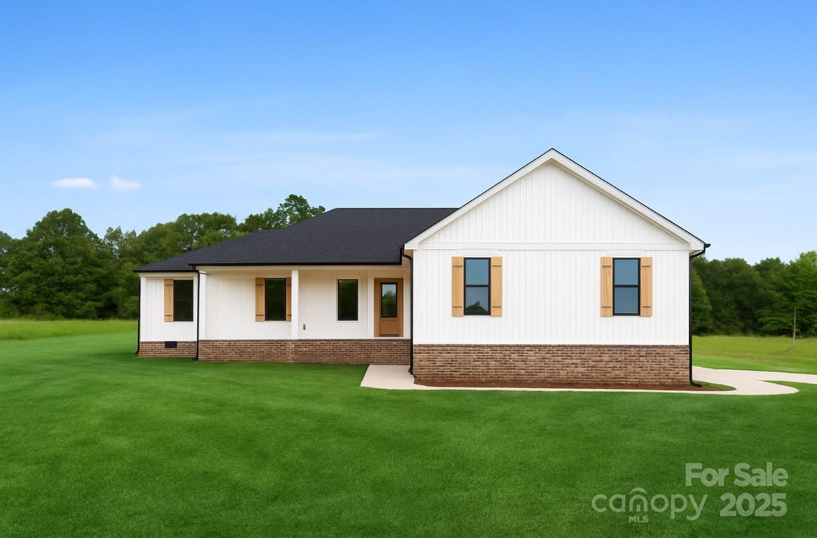 6788 Clyde Wehunt Road Cherryville, NC 28021 - Photo 24 of 25 a view of a house with a yard