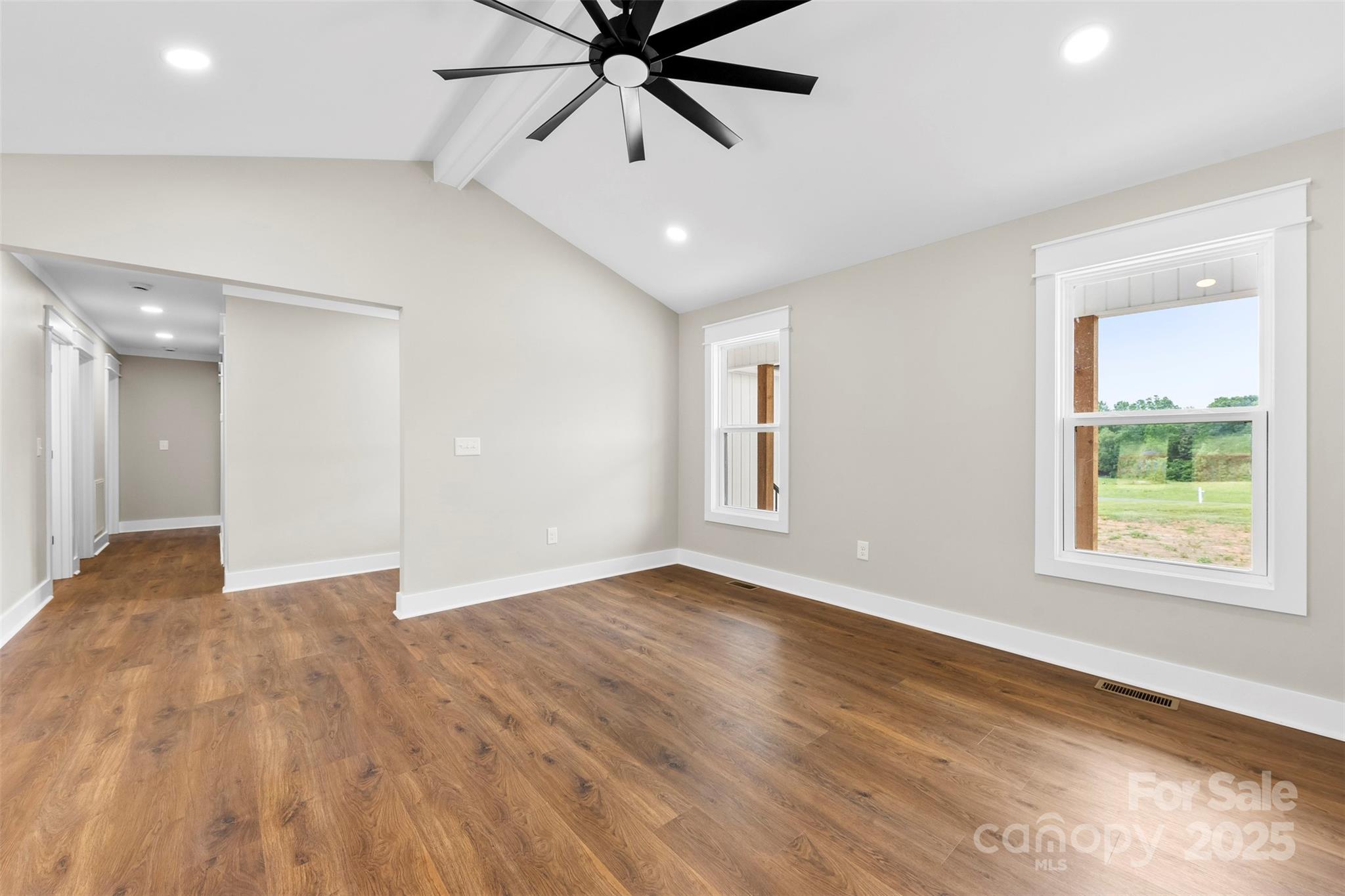 6788 Clyde Wehunt Road Cherryville, NC 28021 - Photo 5 of 25 a view of an empty room with a window and wooden floor