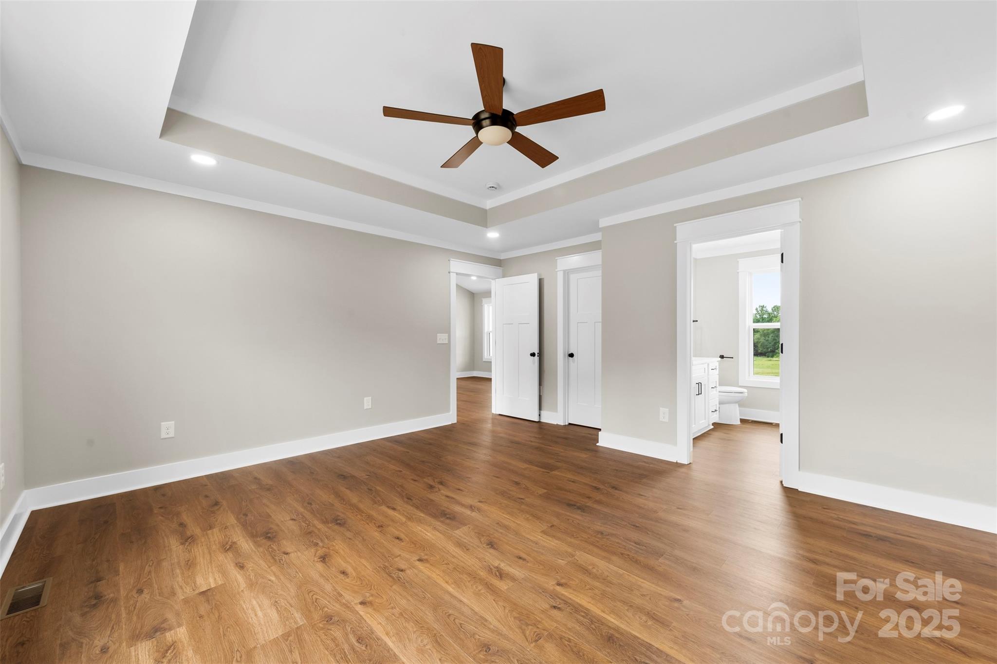 6788 Clyde Wehunt Road Cherryville, NC 28021 - Photo 9 of 25 a view of empty room with wooden floor and ceiling fan