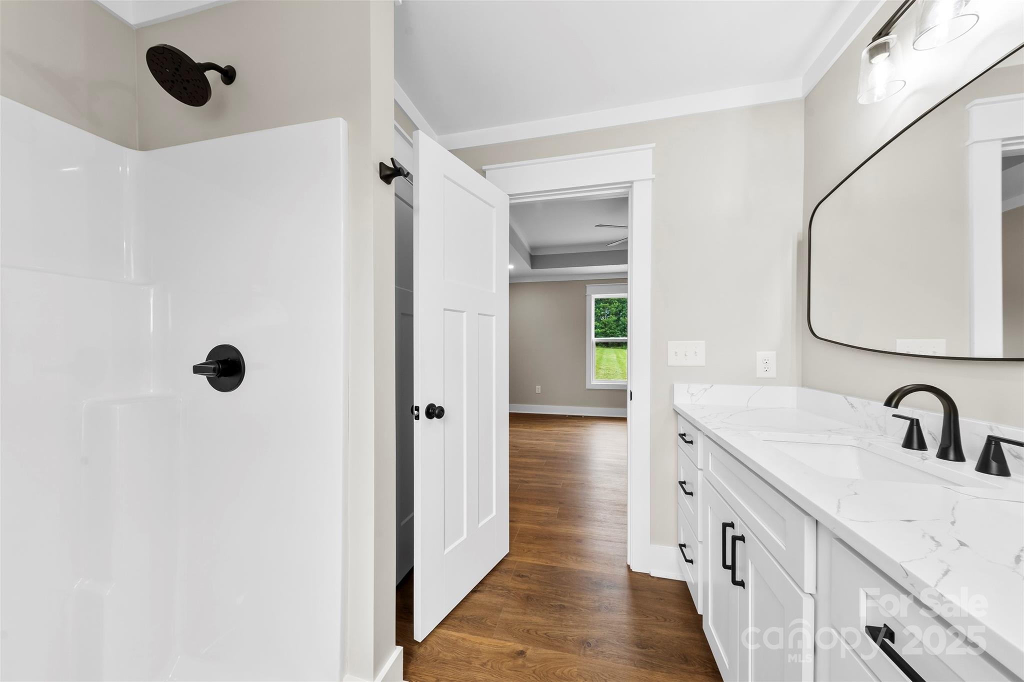 6788 Clyde Wehunt Road Cherryville, NC 28021 - Photo 10 of 25 a bathroom with a double vanity sink and mirror